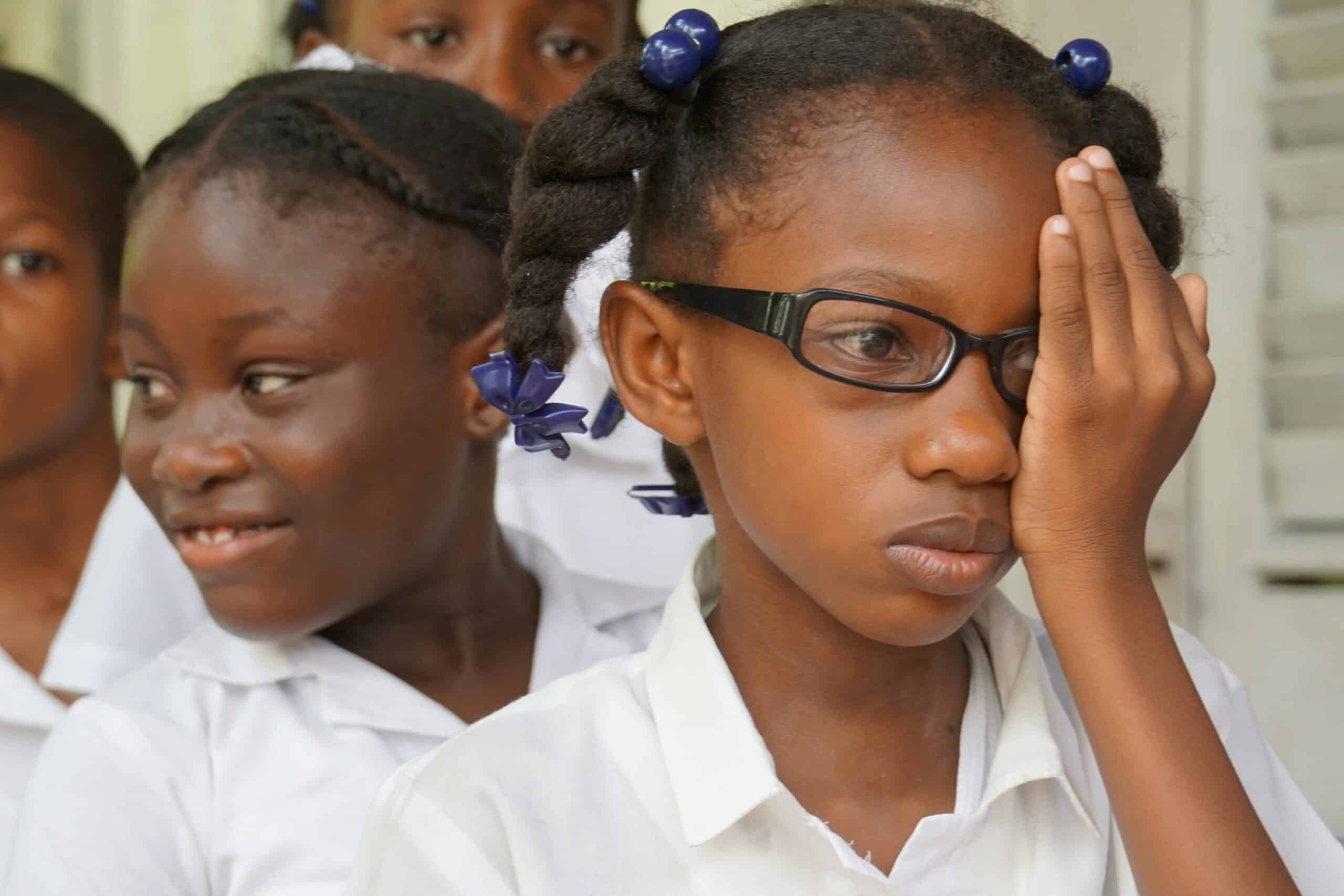 School girls getting eye exam