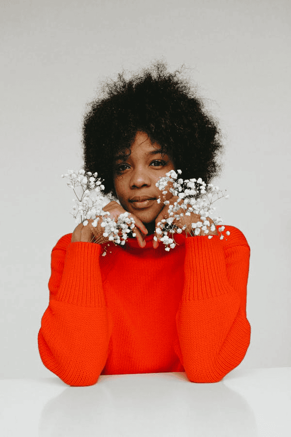 Female in red sweater with flowers