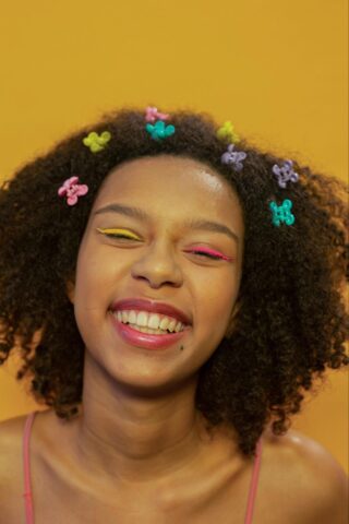 Woman Smiling Wearing Various Hair Clips